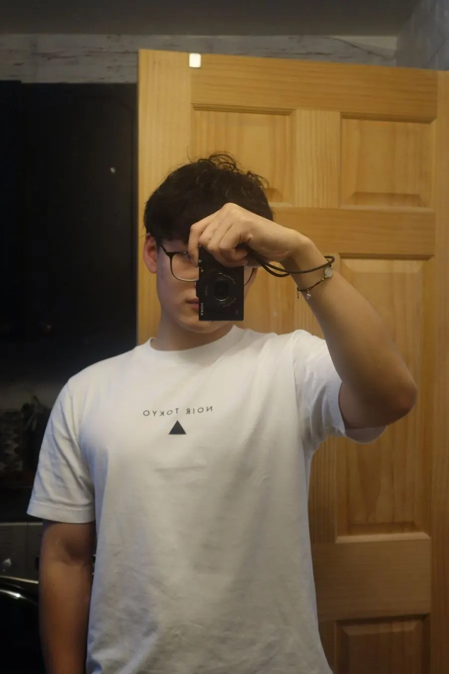 Ping taking a mirror photo with a compact camera